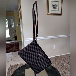 Black and gray checkered Coach Wristlet